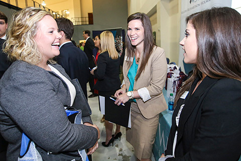 student speaking with employers